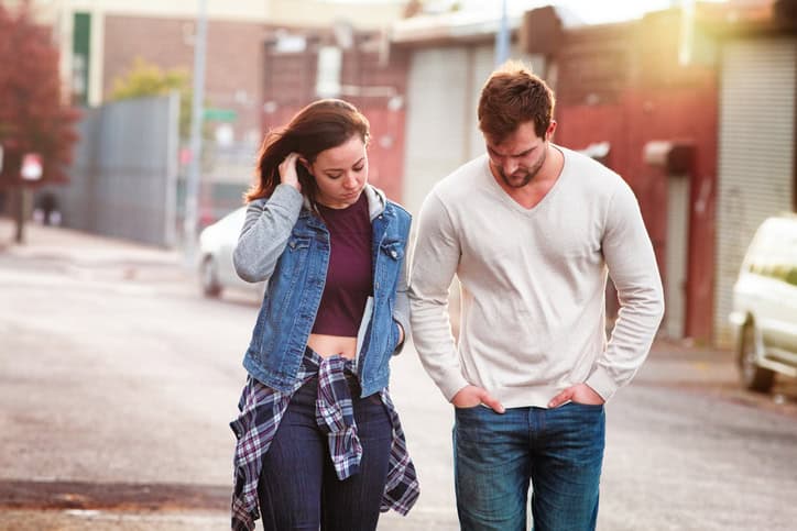 Young couple discussing relationship difficulties in an American urban setting. Photographed in Brooklyn.