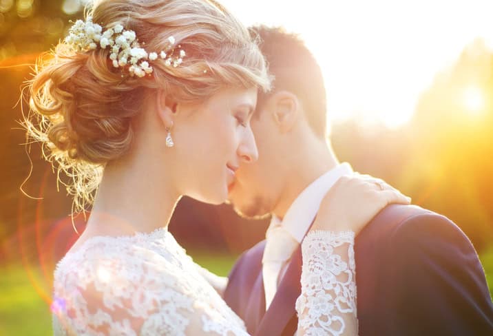Young wedding couple enjoying romantic moment.