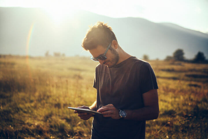 Young man enjoys relaxing in the nature