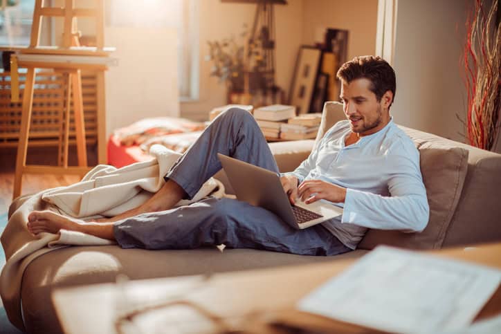 Close up man using a laptop