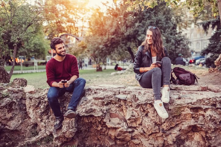 young couple leaves forest happy love