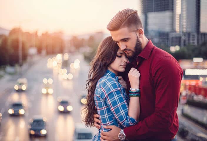 Young couple emracing outside