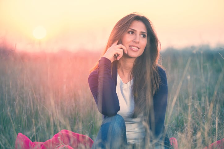 Lovely girl on the phone, afternoon outdoors
