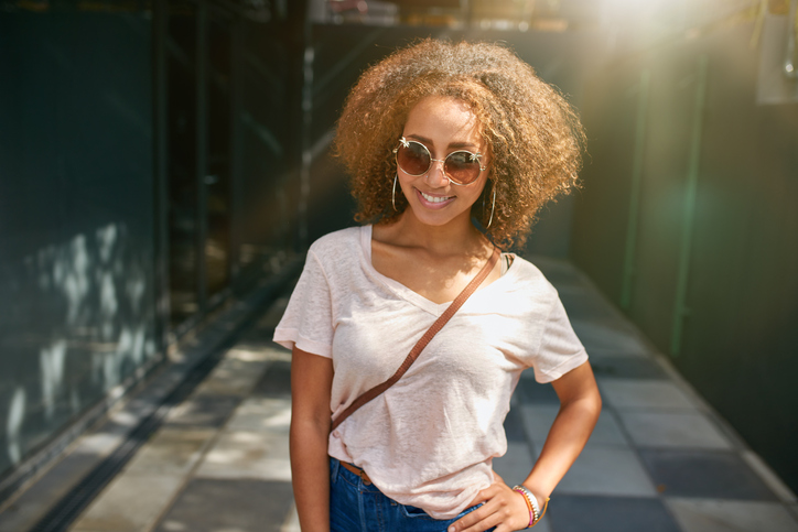 Attractive young woman posing outdoors