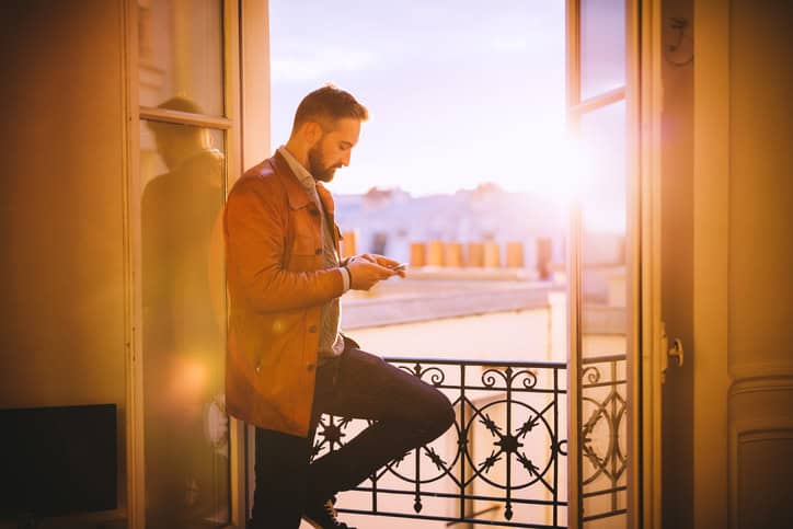 bearded man using smartphone