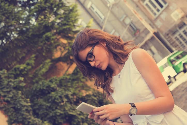Young woman texting