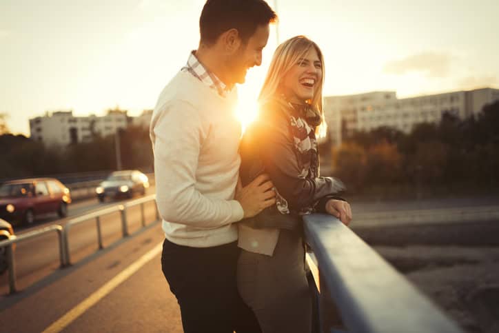 Happy tourist couple in love traveling and bonding