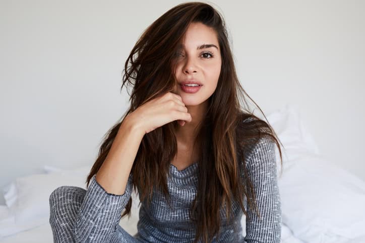 Beautiful brunette in bed, portrait