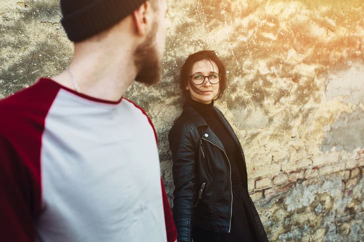 couple posing on a background of the old wall