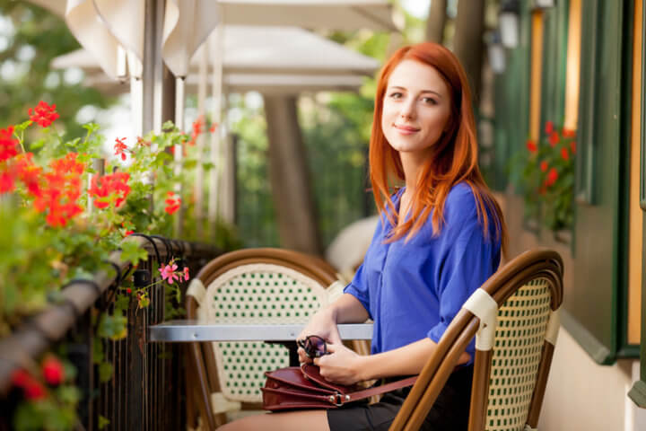 beautiful young woman sitting in the cafe and resting