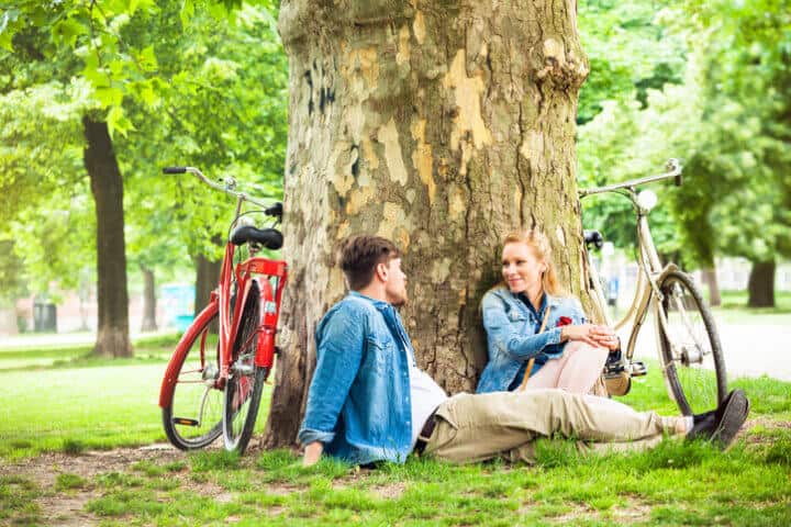 A couple on a date in the park in Berlin, Germany.
