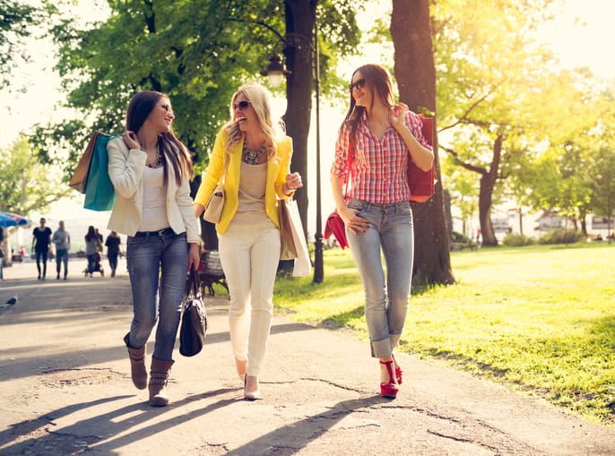 three women walking in the park