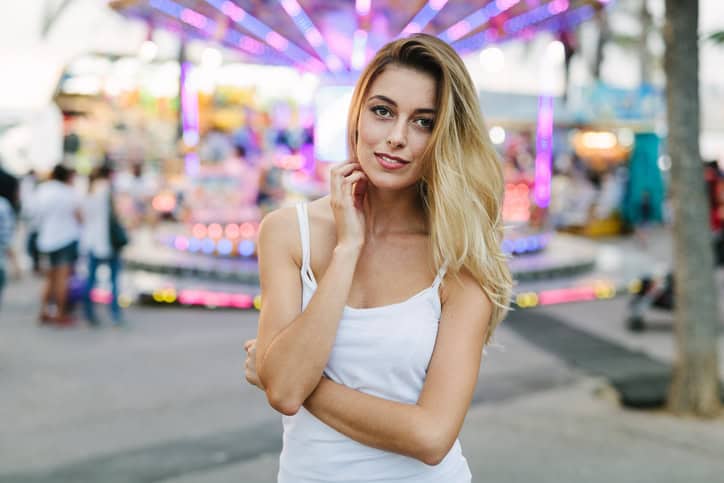 Beautiful woman looking at camera and smiling.