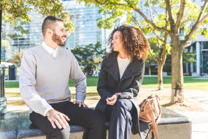 Business woman and man talking