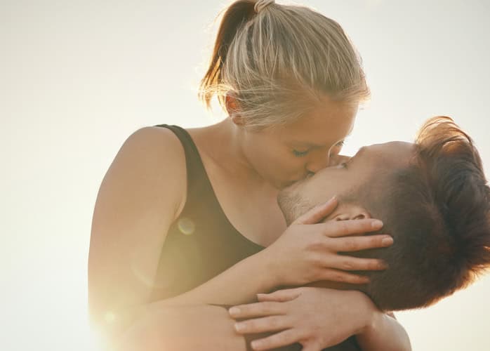 Shot of a young couple kissing outdoors