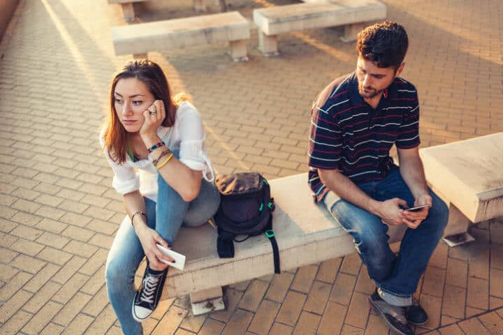 Couple sitting at a distance