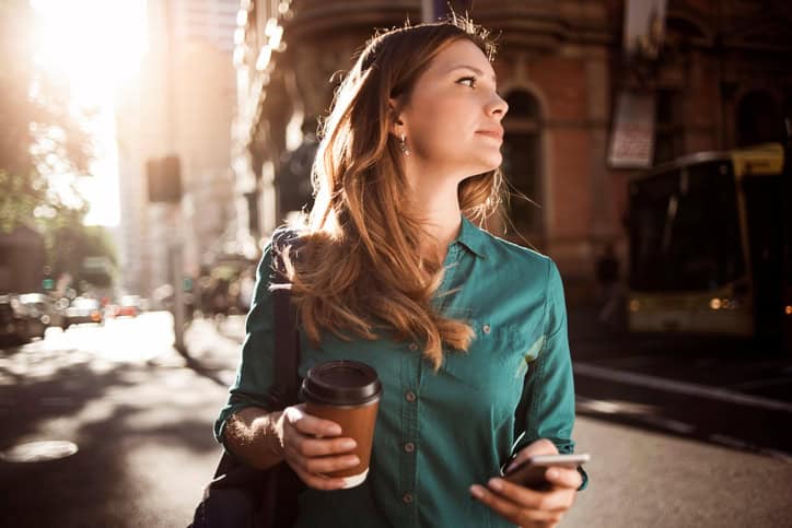 Young woman going to work in the morning. Sydney, Australia.