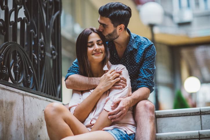 Young couple enjoying in their love at city.