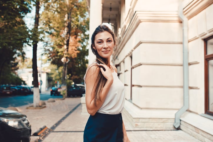 Fashion pretty woman walking through the streets of Old City