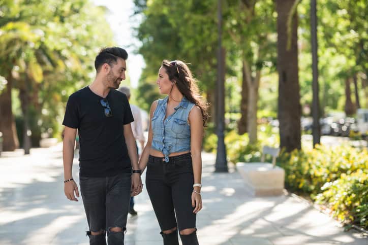 couple holding hands walk romance love