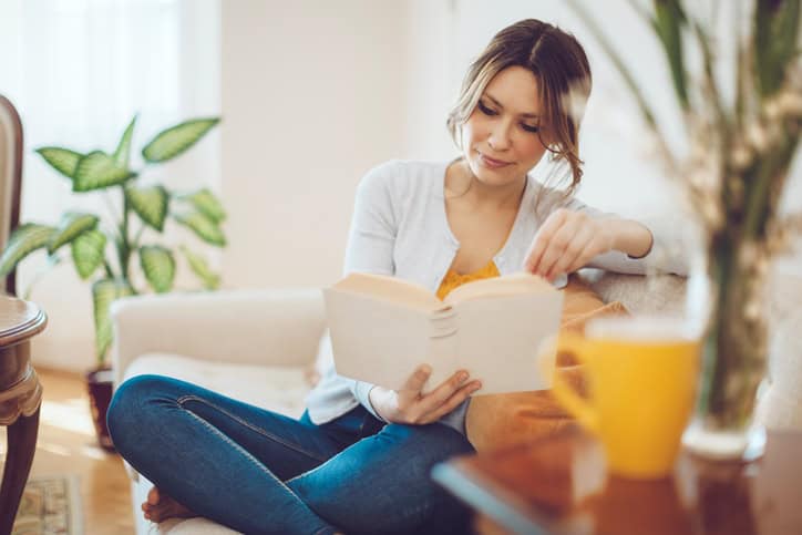 woman reading pretty home alone single