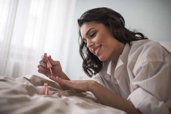 Woman painting her nails.