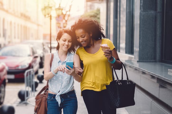 two women one co-author texting