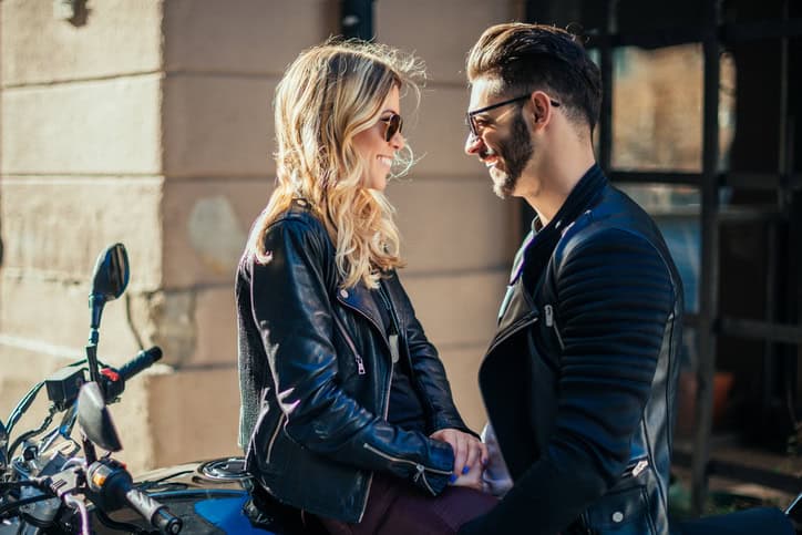 Bikers in love looking at each other.