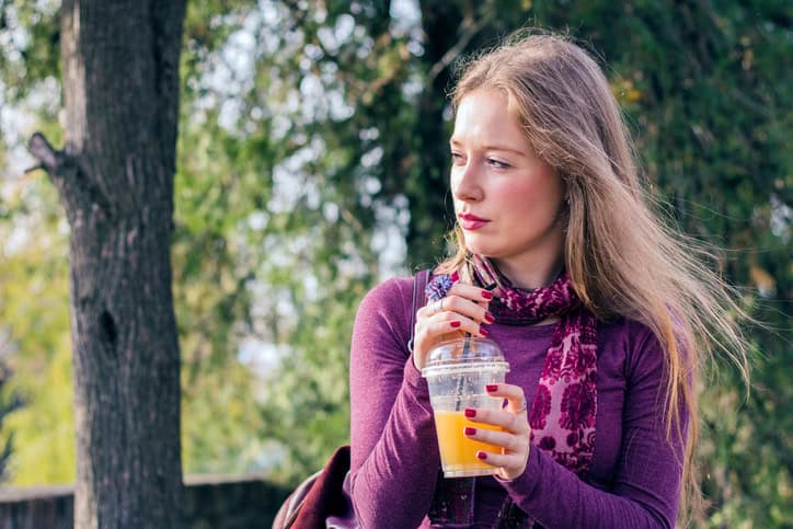 Woman with an orange juice.