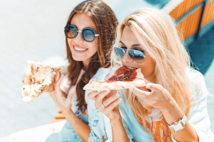 women pizza food friends