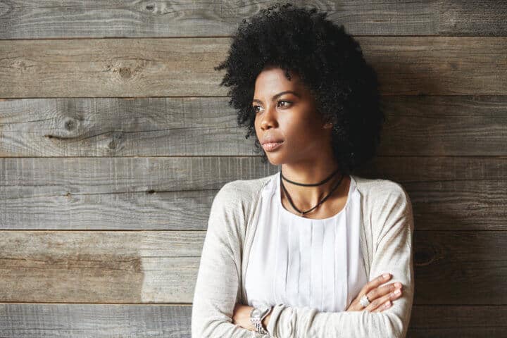 Attractive African American woman with Afro hairstyle standing