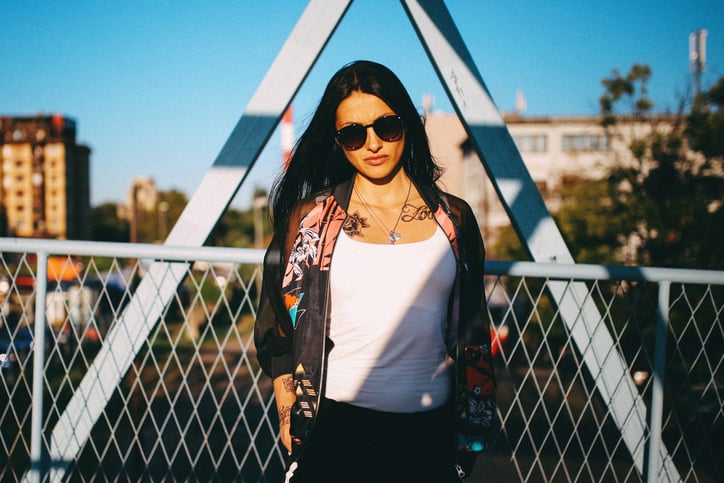 Young beautiful woman in downtown enjoying summertime day