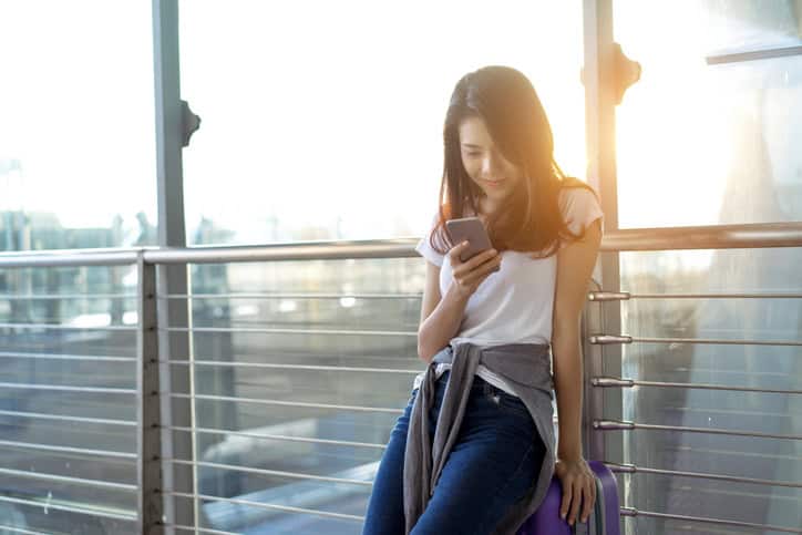 young woman texting ex boyfriend