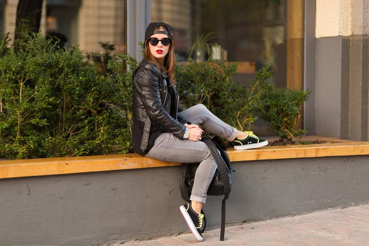 Stylish woman on a city street at summer day