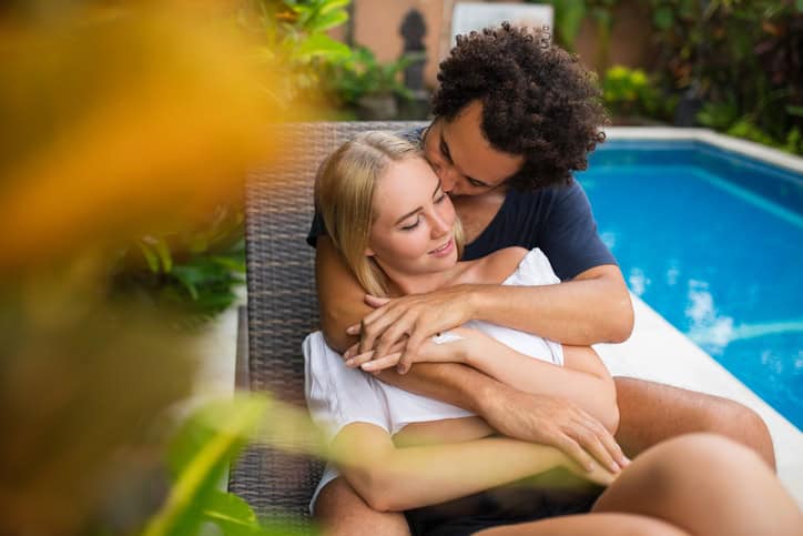 Tender man kissing beloved woman