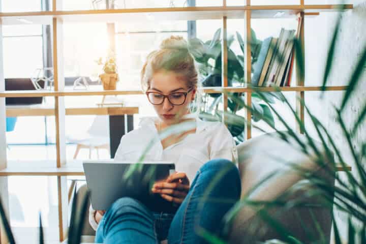 Young beautiful woman working in an alternative office