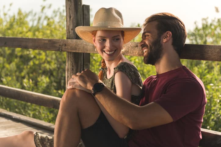 Happy and young couple in love enjoying time outdoors.