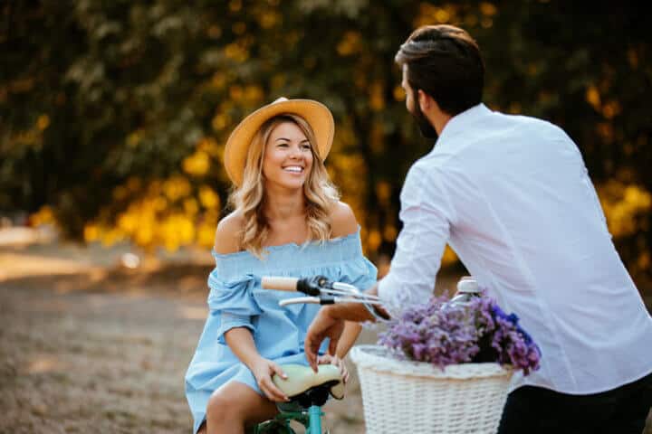 Couple in love enjoying a bike ride outdoors.