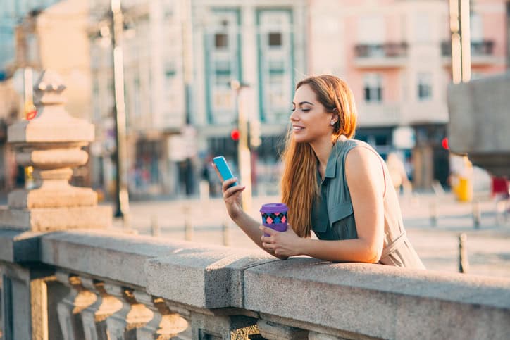 Woman texting in the city