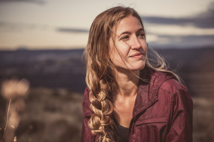 Young Woman Enjoying a Quiet Moment in Nature
