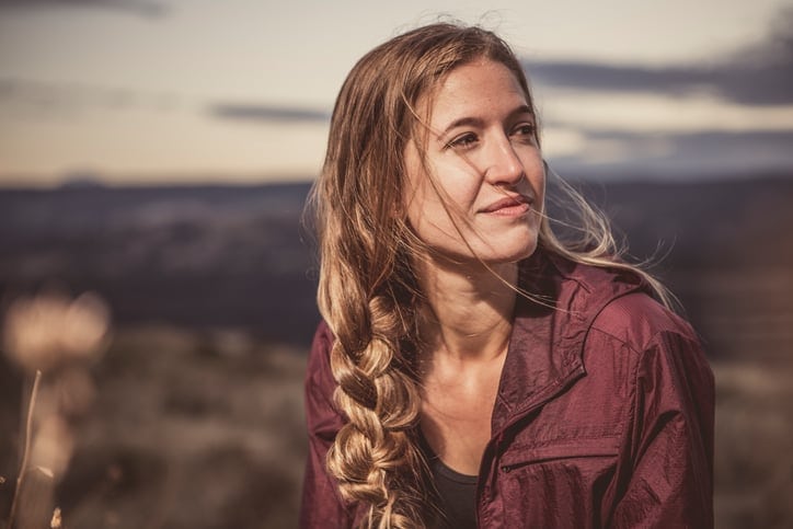 Young Woman Enjoying a Quiet Moment in Nature