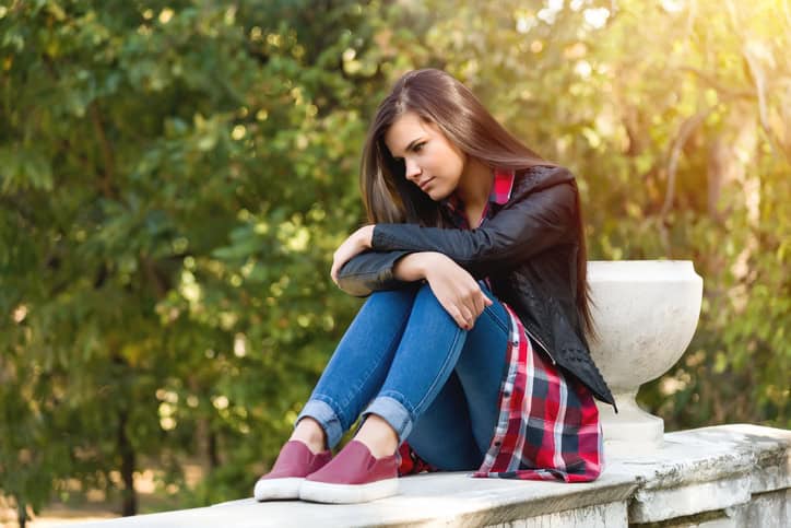 Depressed lonely teenager in the park