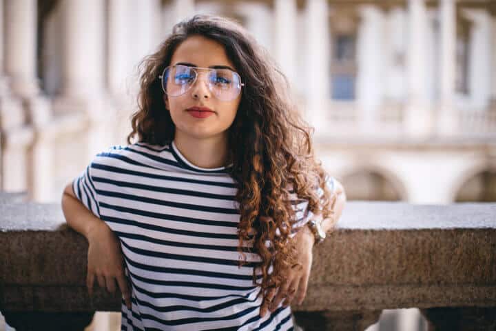Portrait of young woman with curly hair