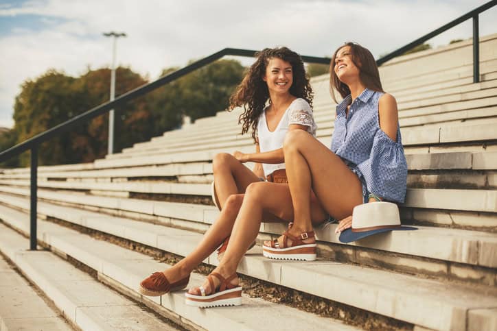 Two young women enjoying sunny day together.