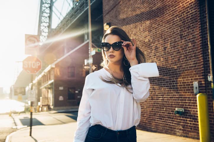 usiness woman wearing sunglasses and white t-shirt
