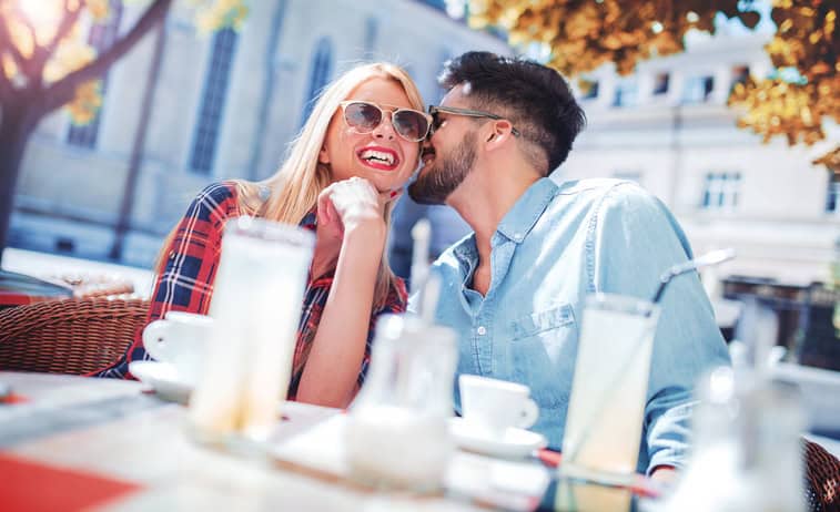 Meeting in the cafe. Romantic couple drinking coffee and lemonade, having a date in the cafe. Dating, love, relationships