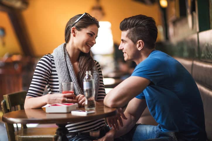 Smiling young couple looking at each other