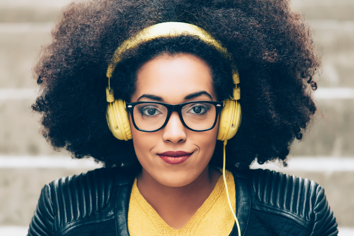 Young woman listening with headphones.