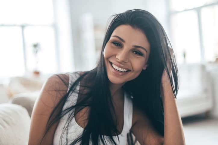 Young brunette woman smiling