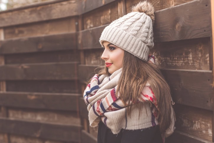 Pretty girl is wearing warm winter clothes